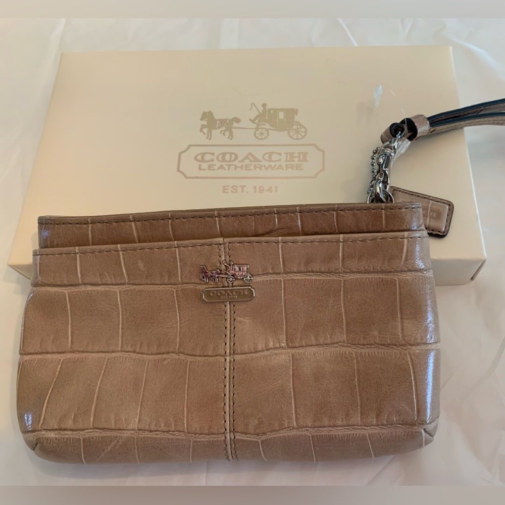 Coach Tan Leather Embossed Clutch
New Without Tag